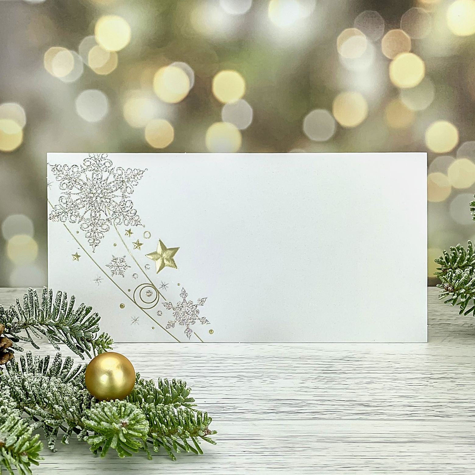 Novoroční–vánoční přání s motivem měňavých a zlatých hvězd, karta, DL formát 200 × 100 mm.