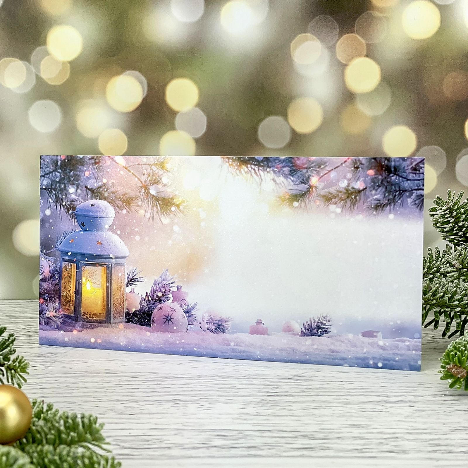 Novoroční–vánoční přání s motivem lampičky se svíčkou a padajícího sněhu, karta, formát 200 × 100 mm.