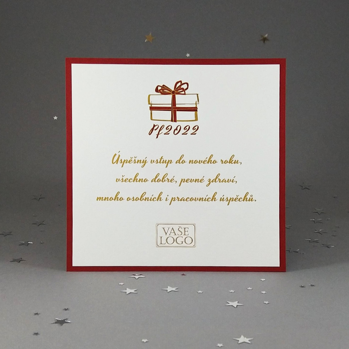 Novoroční – vánoční přání, dvouvrstvá karta s motivem vánočního dárku, čtvercový formát.